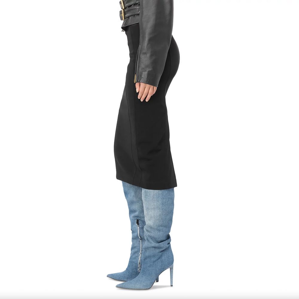 PINKO Black Viscose Skirt with rear zip, slim fit, technical fabric, worn with blue denim boots, side view.