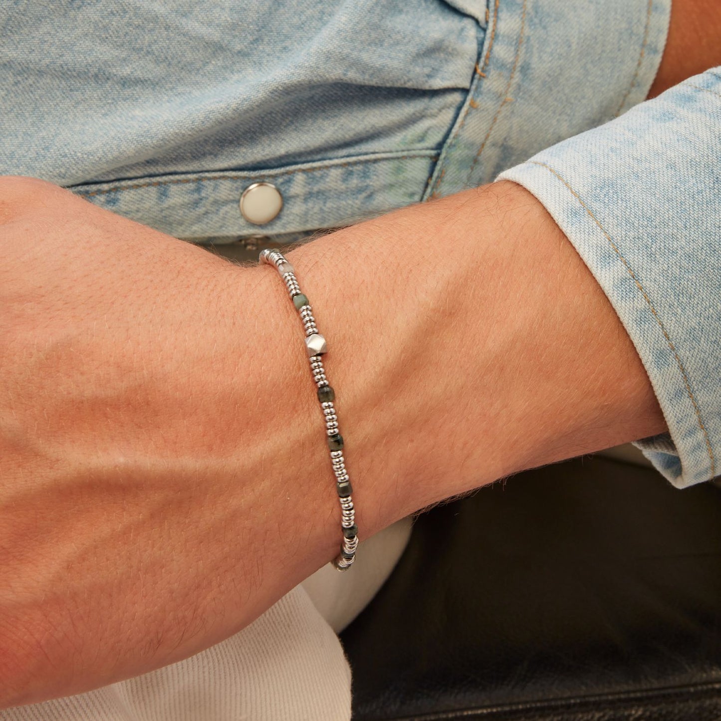 Gent wearing BREIL JEWELS Mod. TJ3647 silver bracelet, chronograph design, water resistant, quartz movement, in official box