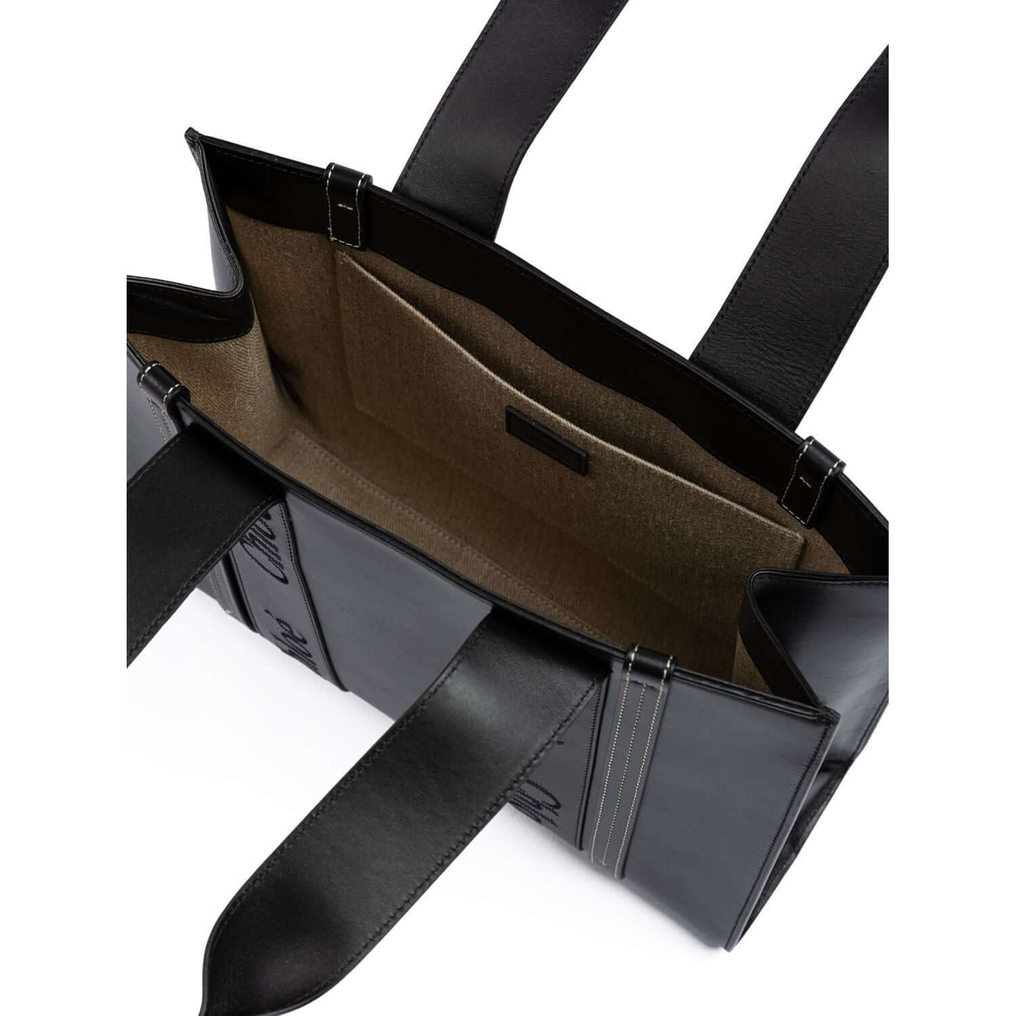 Interior view of Chloé Black Woody Embroidered Logo Leather Medium Tote Bag showing spacious compartments and leather finish.