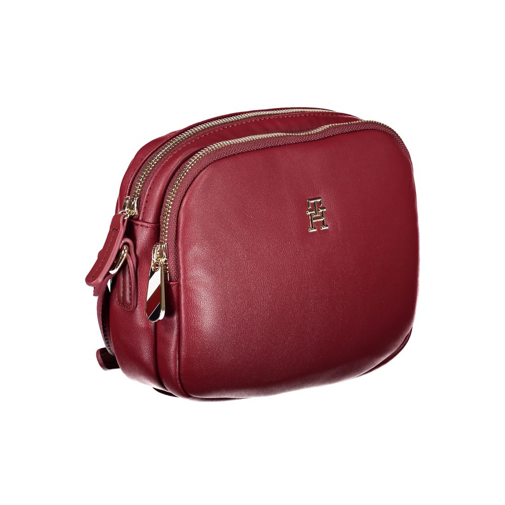 Tommy Hilfiger Red Polyester Handbag with adjustable strap, two compartments, internal pocket, and zip closure, featuring logo.