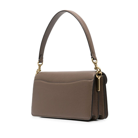 Coach Tabby 26 leather shoulder bag with removable short handle and adjustable strap, brown leather, side view.
