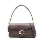 Alt Tag: Coach Tabby 26 leather shoulder bag in earth brown with pebbled texture and gold logo. Features detachable strap, rear slip pocket.