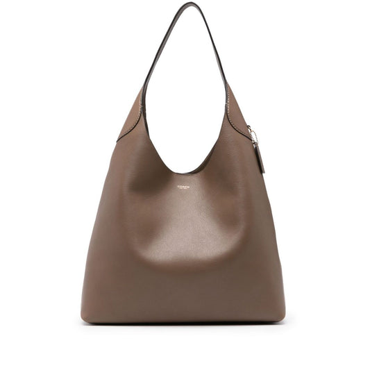 Coach Brooklyn leather hobo bag in light brown calf leather with logo stamp, single shoulder strap, and internal patch pocket.