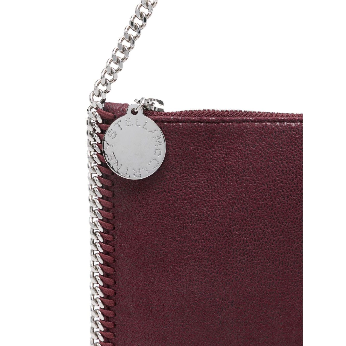 Stella McCartney Falabella clutch in amaranth purple with chain-link strap and logo pendant.