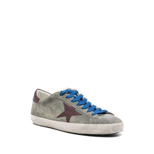 Golden Goose Super-Star sneakers in desert sage green with front lace-up fastening, padded ankle, and rubber sole.