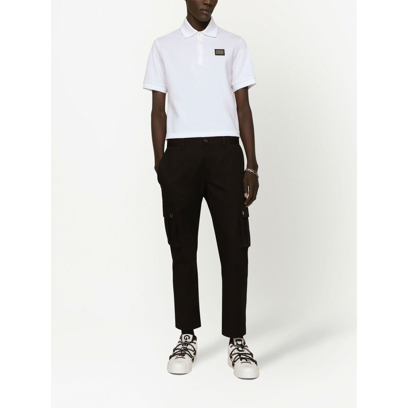 Dolce & Gabbana Logo cotton polo shirt in white, featuring a piqué weave, logo plaque, polo collar, short sleeves, and straight hem.