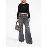 Diesel Sweaters Black with cut-out detailing, long sleeves, and cropped hem, worn by model with black jeans and stylish handbag.