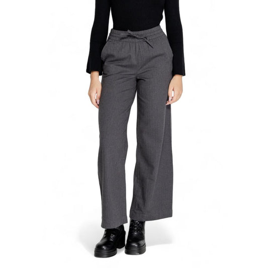 Woman wearing Jacqueline De Yong Gray Cotton Casual Pants with high elasticated waist and wide palazzo cut for comfortable elegance.