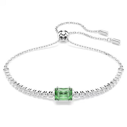 Elegant silver bracelet featuring a central green gemstone and adjustable chain, perfect for adding a touch of sophistication to any outfit.