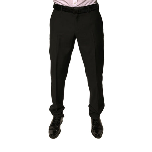 Model wearing Dolce & Gabbana Black Wool Tapered Formal Dress Pants, showcasing mid waist design and elegant tailoring.