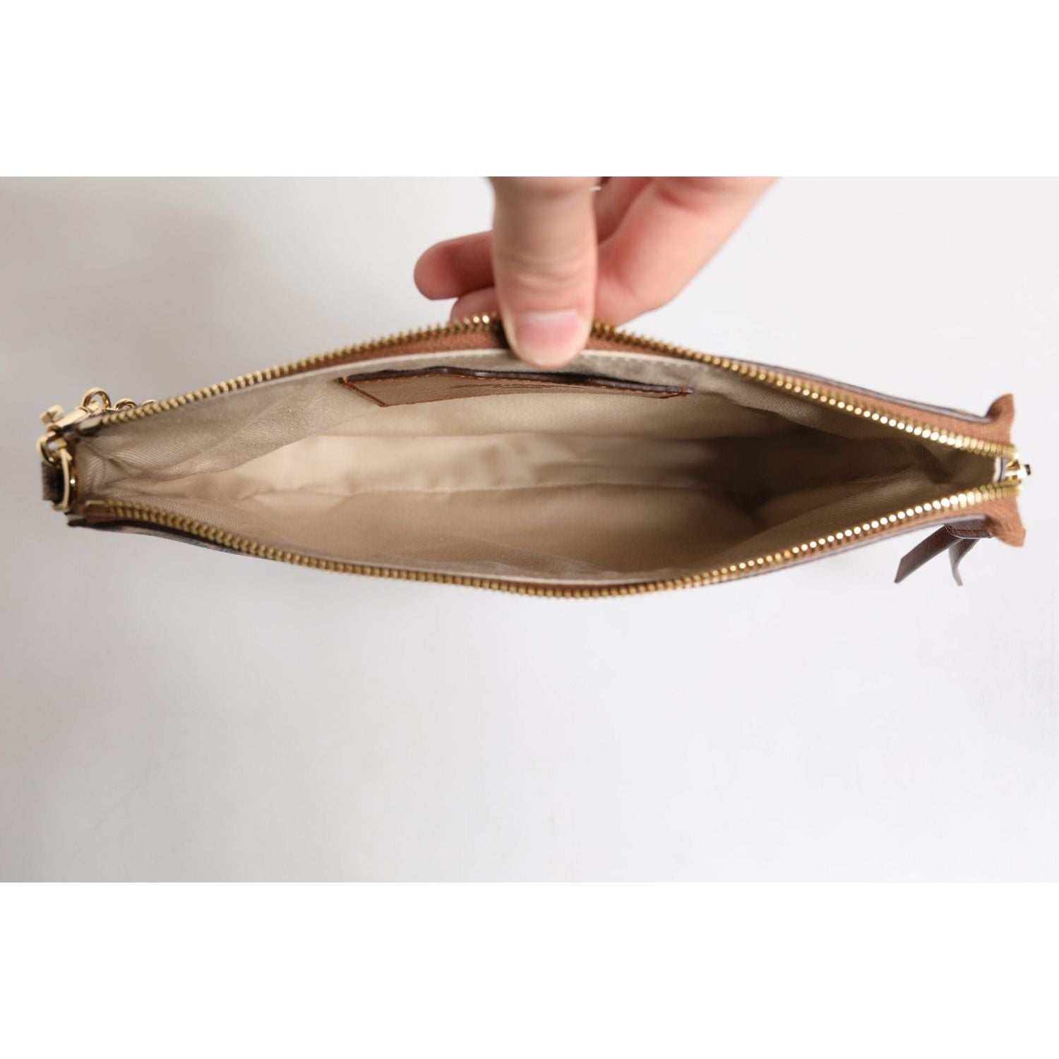 Front view with bag zipped and handles upright.