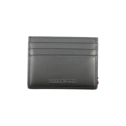 Tommy Hilfiger Black Leather Wallet with card holder, central pocket, card spaces, contrast details, and logo.