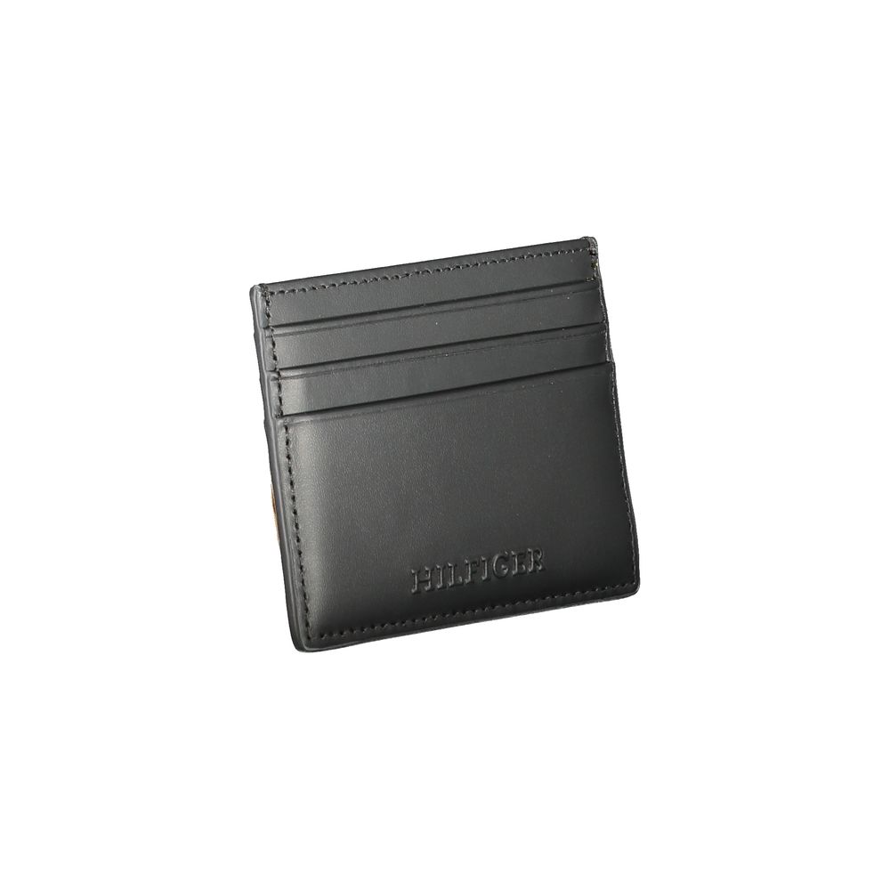 Tommy Hilfiger Black Leather Wallet with card holder, central pocket, and logo, featuring contrast details.