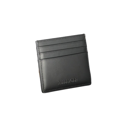 Tommy Hilfiger Black Leather Wallet with card holder, central pocket, and logo, featuring contrast details.