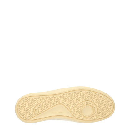 Sole view of Jil Sander White Leather Low Top Sneakers featuring textured pattern, sporty glam style, and light grey accents.