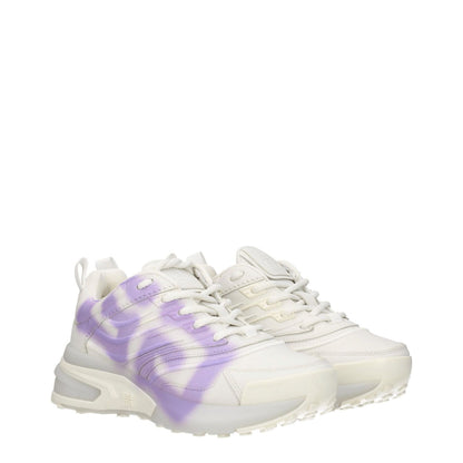 Givenchy Beige Leather Low Top Sneakers with lilac detail, featuring a lace-up closure, mid heels, and rubber soles. Fashionable casual wear.