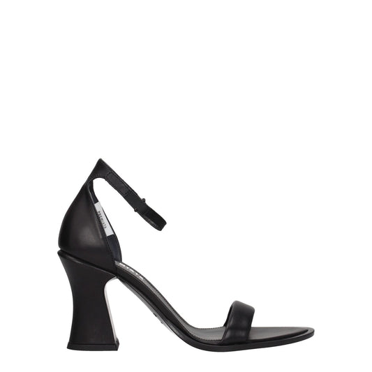 Premiata Black Leather Flat Sandals with buckle closure and high heel, featuring a vintage effect and side logo on a leather sole.