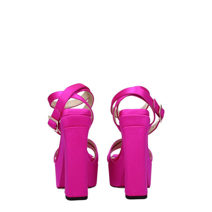 Rear view of Jimmy Choo Pink Satin Platform Sandals with high heels and buckle closure, showcasing fuchsia color and leather sole.