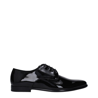 Dolce & Gabbana Black Leather Oxfords And Derbies with a pointy toe and lace-up closure, featuring a low flat heel and leather sole.