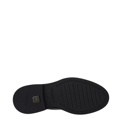 Sole of Dolce & Gabbana Black Leather Ankle Boots in black patent leather with rubber sole, style code F82951, MPN A60602A147180999.