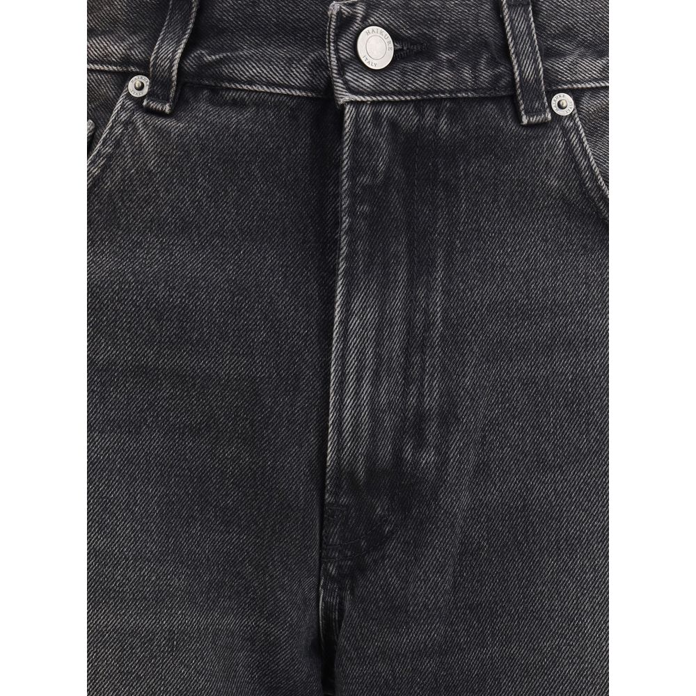 Haikure Black Cotton Relaxed Fit Jeans with wide-leg design, medium waist, five-pocket style, and logoed leather patch on the back.