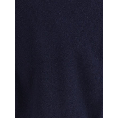Extreme Cashmere Blue Cashmere Cashmere Sweater - close-up of fabric texture, showcasing luxurious knit material in deep blue shade.