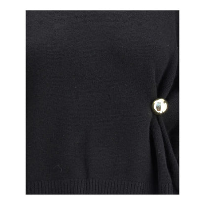 Close-up of Loulou De Saison Black Wool Sweatshirt showing gold detail and draped effect.