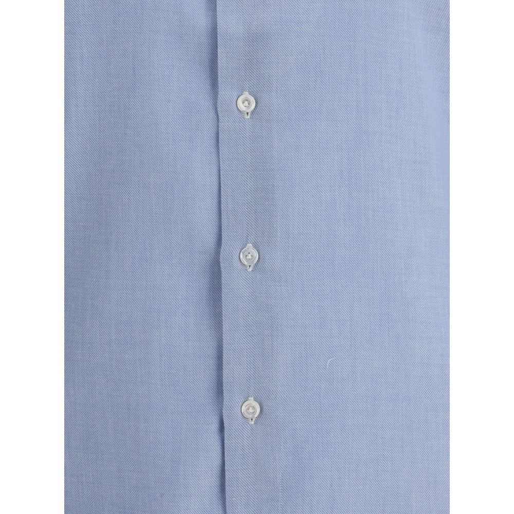 Close-up of Finamore Light Blue Cotton Dress Shirt with button detailing, made from fine cotton and cashmere blend.
