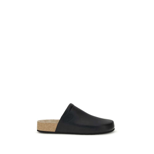 Balenciaga Black Calf Leather Bos Taurus Mules with cork insole and minimal design, showcasing sophisticated essential style for AW25 season.
