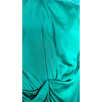 Close-up of Dolce & Gabbana Dark Green Viscose Long Sleeve Midi Dress twist detail in satin fabric.