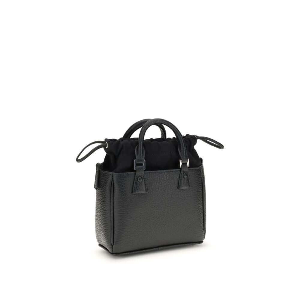 Margiela Black Calf Leather Bos Taurus Shoulder Bag with elegant design and exposed hand-painted edges, AW25 season, 16x16x6 dimensions.