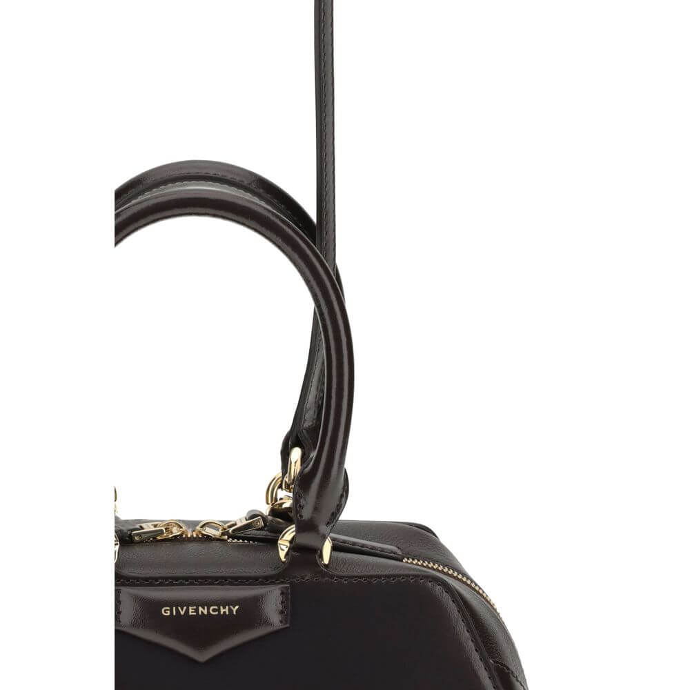 Close-up of Givenchy Brown Calf Leather Bos Taurus Handbag featuring embossed logo and gold finish details.