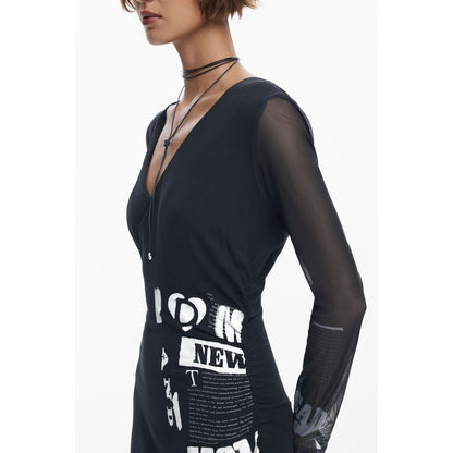 Woman wearing Desigual Black Polyester Women Dress with V-neck and long sleeves, showcasing bold design and comfort.
