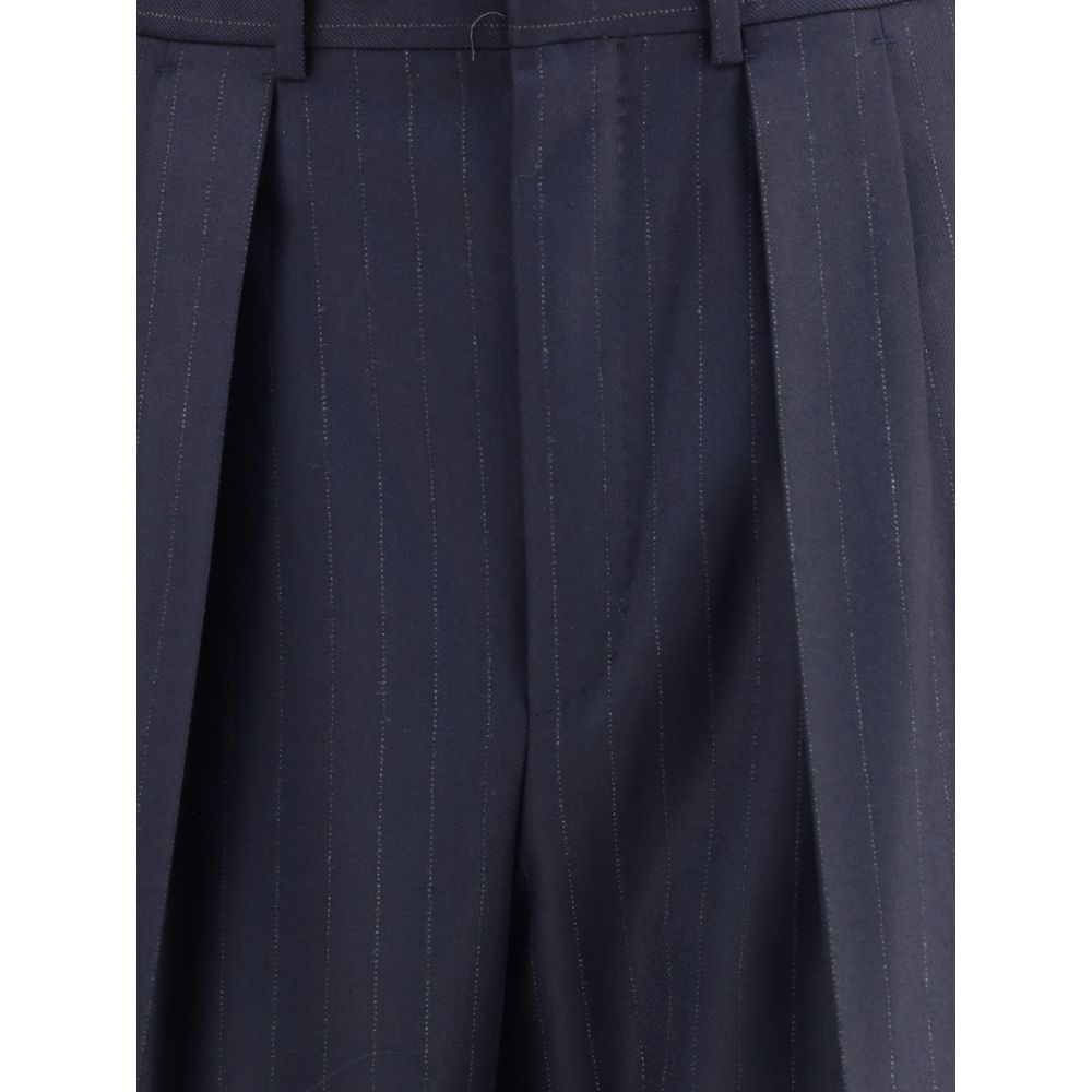 Close-up of Tom Ford Blue Wool Dress Pants with pinstripes and pleats, showcasing high-quality tailoring and elegant design.
