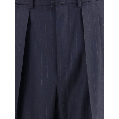 Close-up of Tom Ford Blue Wool Dress Pants with pinstripes and pleats, showcasing high-quality tailoring and elegant design.