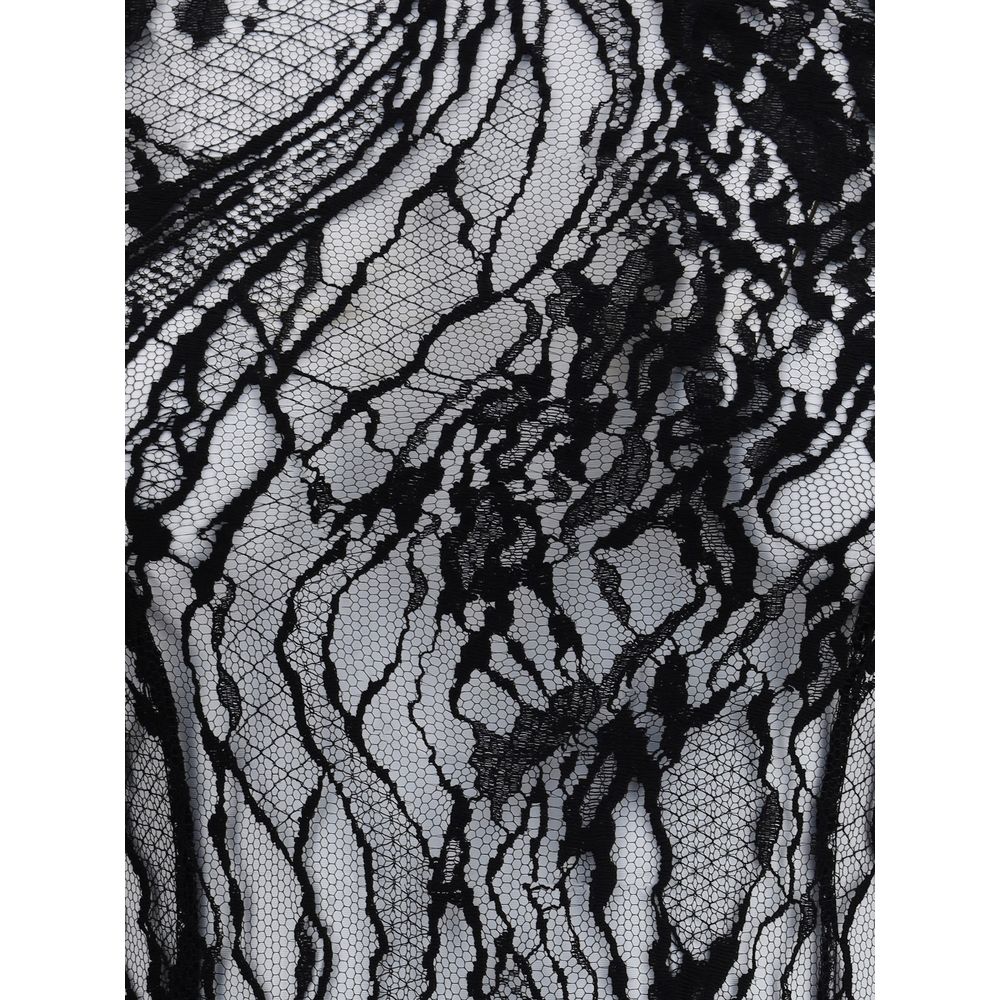 Close-up view of sheer lace on Balmain Black Cotton Top with intricate pattern, a sophisticated garment for bold, feminine looks.