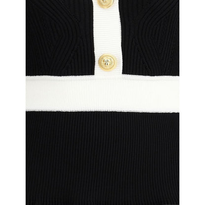 Close-up of Balmain Black Viscose Casual Dress with gold embossed buttons and ribbed trim detailing.