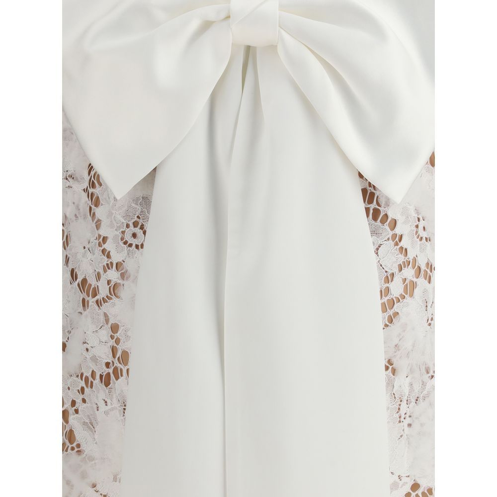 Close-up of large bow on Self-Portrait White Nylon Casual Dress with lace detailing and satin fabric, showcasing elegant design.