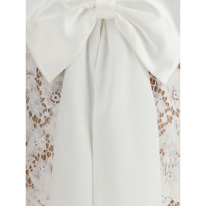 Close-up of large bow on Self-Portrait White Nylon Casual Dress with lace detailing and satin fabric, showcasing elegant design.
