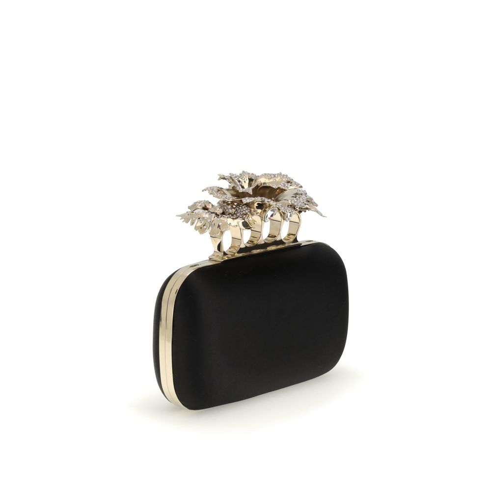 Alexander McQueen Black Silk Clutch Bag with crystal carnation knuckle handle and gold chain, elegant accessory for AW25 season.