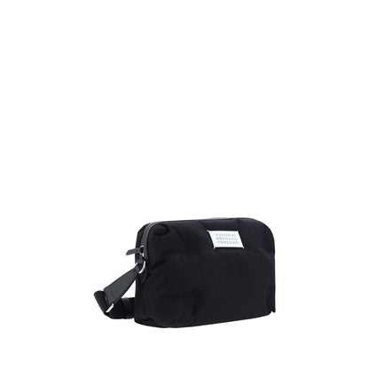 Margiela Black Nylon Shoulder Bag with calfskin leather inserts, adjustable strap, and contrasting logo label, AW25 collection.