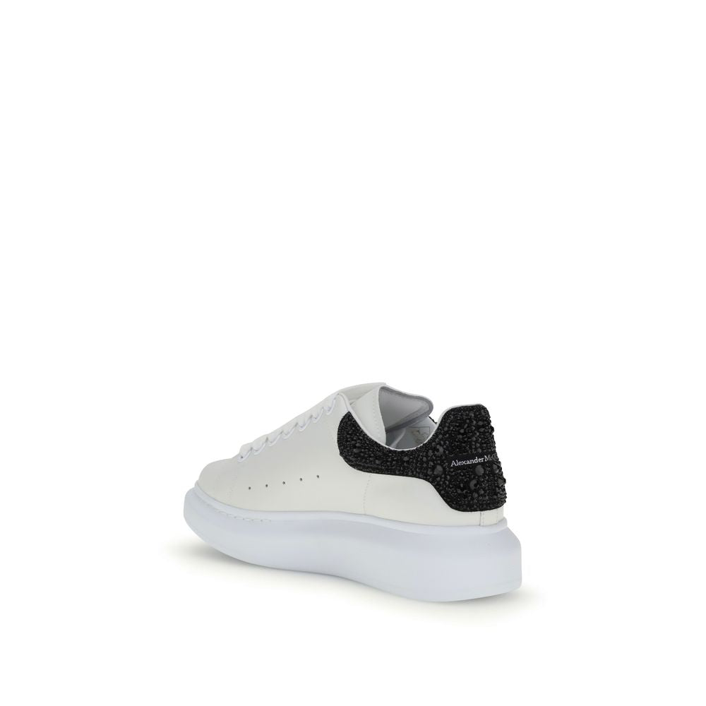 Alexander McQueen White Leather Chunky Sneakers with crystal-accented black heel and thick rubber sole, back view.