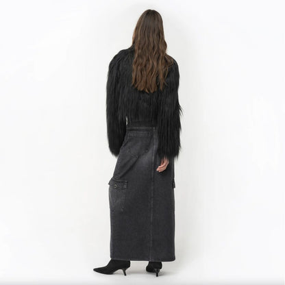 Back view of woman wearing PINKO Black Cotton Skirt with zip closure, featuring back, flap, and side pockets.