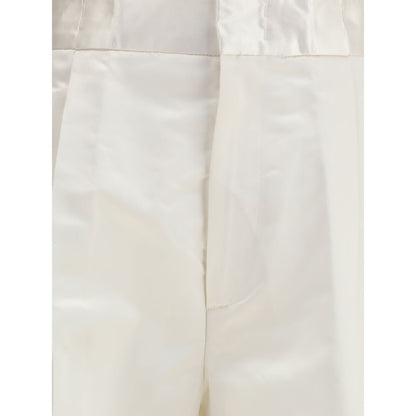 Close-up of SA SU PHI Cream Silk Pants with front zipper and pockets, featuring a palazzo style and regular fit.