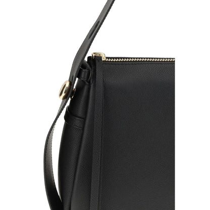 Close-up of Tory Burch Black Calf Leather Bos Taurus Shoulder Bag featuring gold-tone accents and pebbled leather texture.