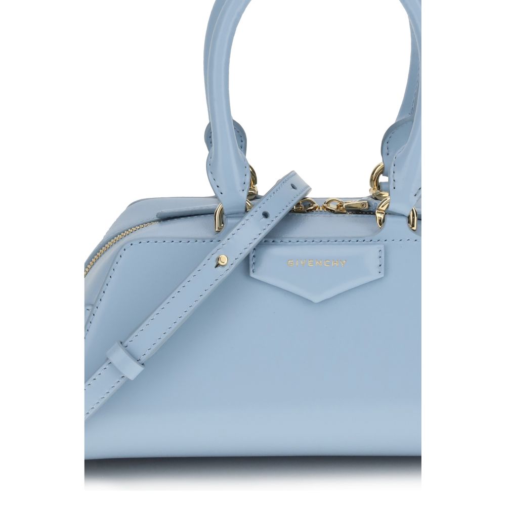 Givenchy Light Blue Calf Leather Bos Taurus Handbag with gold-finish details and adjustable strap, showcasing elegant design.