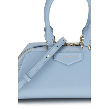 Givenchy Light Blue Calf Leather Bos Taurus Handbag with gold-finish details and adjustable strap, showcasing elegant design.