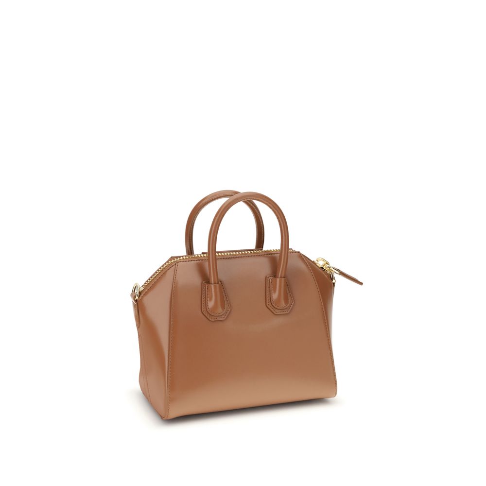Givenchy Brown Calf Leather Bos Taurus Handbag with geometric design, top handles, and adjustable shoulder strap.