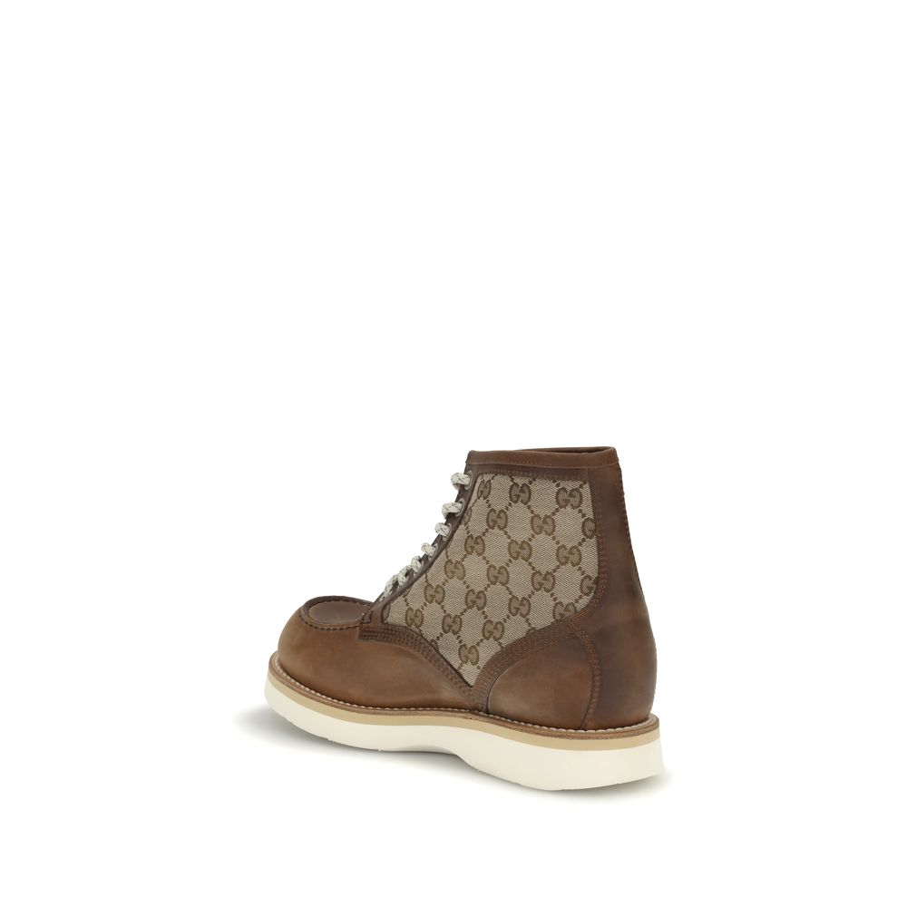 Gucci Brown Leather Lace-Up Boots with GG fabric and Goodyear construction, side view showcasing classic design and craftsmanship.