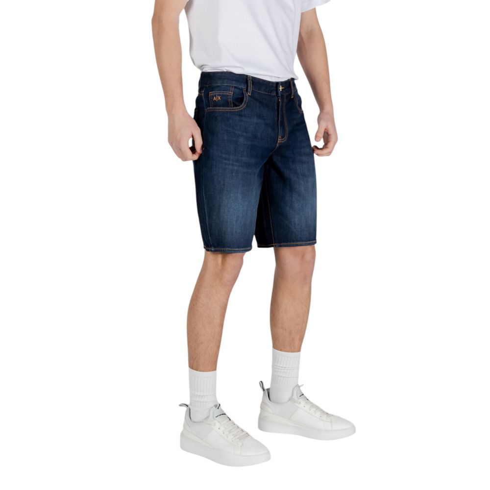 Man wearing Armani Exchange blue cotton Bermuda shorts, spring/summer collection, featuring 99% cotton and 1% elastane blend.
